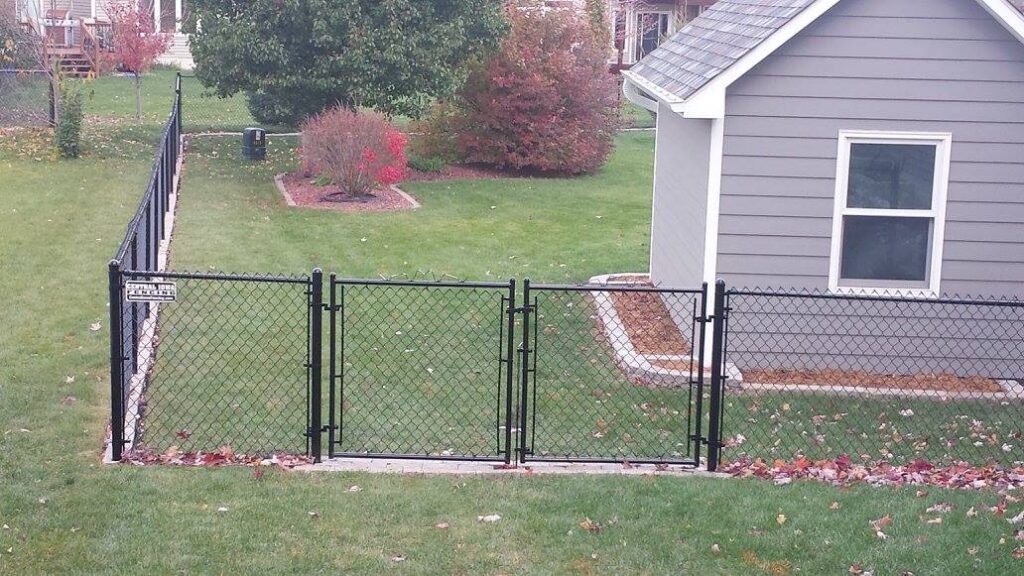 black chain link fence residential backyard