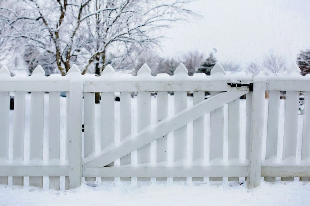 fence covered in snow